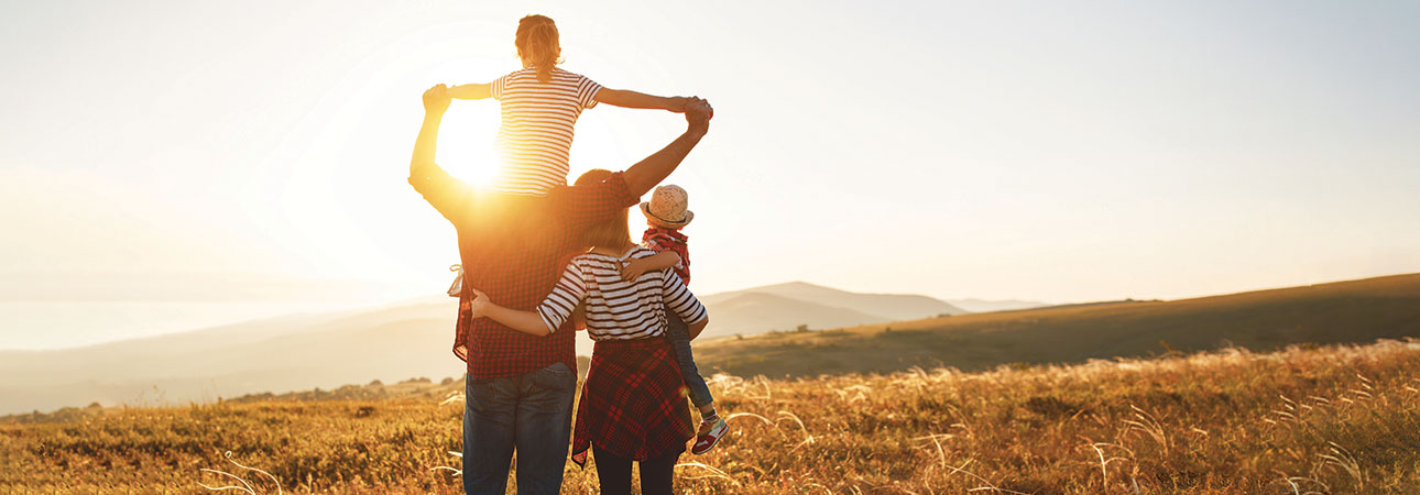 family outside at sunset