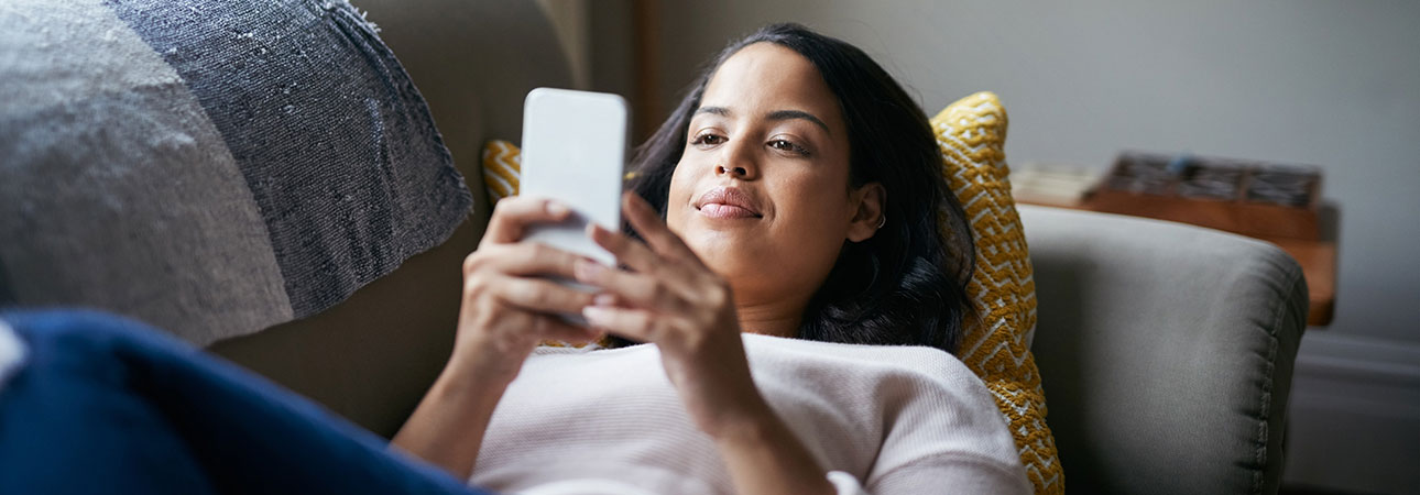 girl on couch with phone